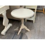 A cream painted tripod table, 61cm Tall x 55cm diameter