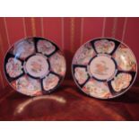 A pair of early 20th Century Japanese Imari chargers, 30cm diameter