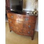 A 19th Century mahogany two over two bow-front chest of drawers with embossed plate handles,