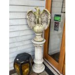 A reconstituted eagle on pedestal