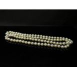 An opera length pearl necklace with 9ct gold clasp, 81cm long