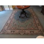 A modern green Chinese rug with floral border, 282cm x 188cm
