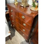 A Mid to late 19th Century mahogany chest of two over three drawers with oval embossed plate