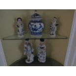 Continental blue and white ceramic figures and a pair of modern Oriental lidded pots, tallest 25.5cm