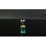 An 18ct gold emerald pendant 8mm x 5mm emerald, 1.4g
