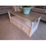 A chabby-chic coffee table with limed oak top undertier over drawer base, 55cm x 109cm x 48cm