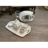 A modern English teaset for two and Swan teasmaid