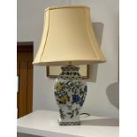 A pair of Chinese modern vase form lamps with hand painted floral and leaf design, cream shades,