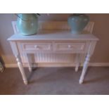 A modern two drawer hall table painted in cream with reeded legs 80.5cm x 100cm x 37cm