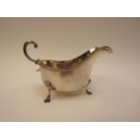 An Asprey of London silver sauce boat, s-scroll handle, London 1913, 15cm long, 134g