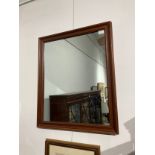 A modern mahogany framed rectangular wall mirror, 74cm x 61cm