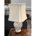 A pair of modern ceramic pierced vase form lamp bases with white shades, 54cm tall, Collectors