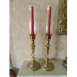A pair of etched glass hurricane lamps with brass candle supports, 55cm tall, Collectors
