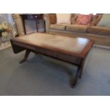 A 20th Century Regency style drop end coffee table with leather inset top, nicely carved legs,