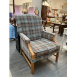 A modern tartan upholstered armchair with loose cushion seat, stud detail, varnish flaking to arms