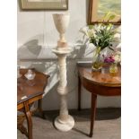 A 20th Century onyx carved vase on twist column stand, the vase with light to interior, 148cm tall