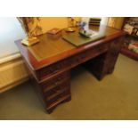 A Georgian style twin pedestal desk with leather inset top, scuffing present, 80cm x 137cm x 69cm