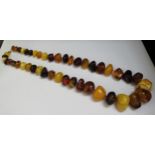 A large multi-colour amber irregular shape bead necklace, 80cm long, 224g