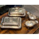 Two silver plate entree dishes and a pair of plated sauce boats (4)