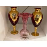 A pair of 20th Century ruby and gilt glass pedestal vases with hand painted floral detail