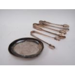 A silver pin dish and three pairs of silver sugar tongs, various makers and dates, 206g