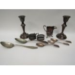 Mixed silver items including a pair of weighted candlesticks, 15.5cm tall, Edwardian jug, part cruet
