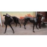 A pair of hollow cast bronze whippets or greyhounds, unsigned, both approximately 53cm x 67cm