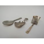 Three silver tea caddy spoons one with mother-of-pearl handle