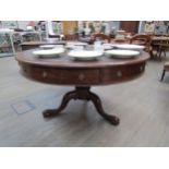 A Victorian drum/rent table, with original skiver over four frieze drawers and four dummy drawers on