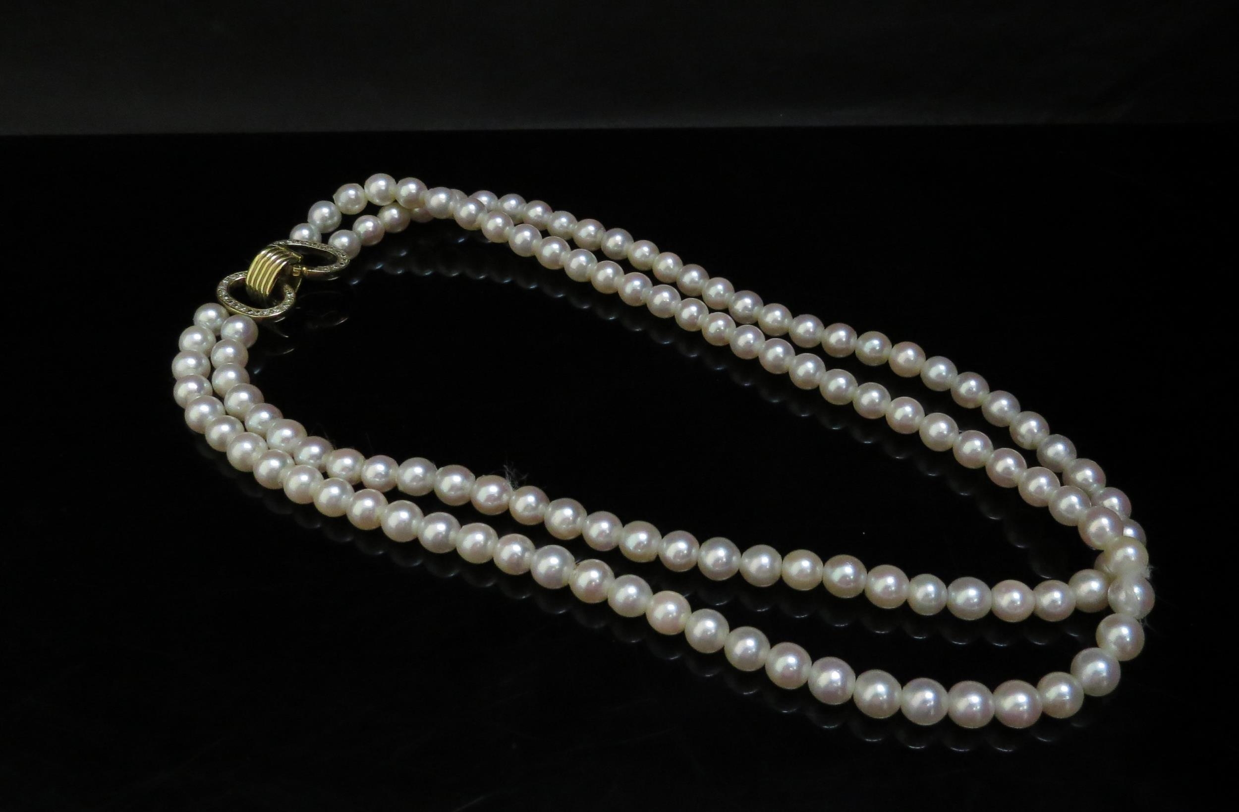 A double stranded pearl necklace 19cm long, diamond encrusted clasp, 42cm long
