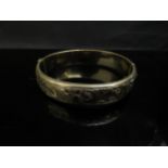 A 9ct gold metal core bangle