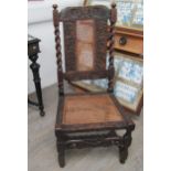 A Charles II walnut crinoline chair with cane back and seat, barley twist supports all over carved