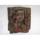 A 17th Century polychrome, carved wood Angel corbel, 30cm x 28cm