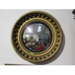 A 19th Century Regency gilt circular mirror with ball detail 40cm diameter, damage present