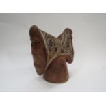 A 19th Century Ethnic handcrafted headrest with face ends, carved line decoration, 28cm x 26cm