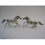 Two 925 silver galloping horses with import marks for London, makers mark W.S.G., 8.5cm and 7.5cm