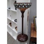 A Tiffany style leaded glass uplighter on short metal base. 85cm high. Collectors electrical