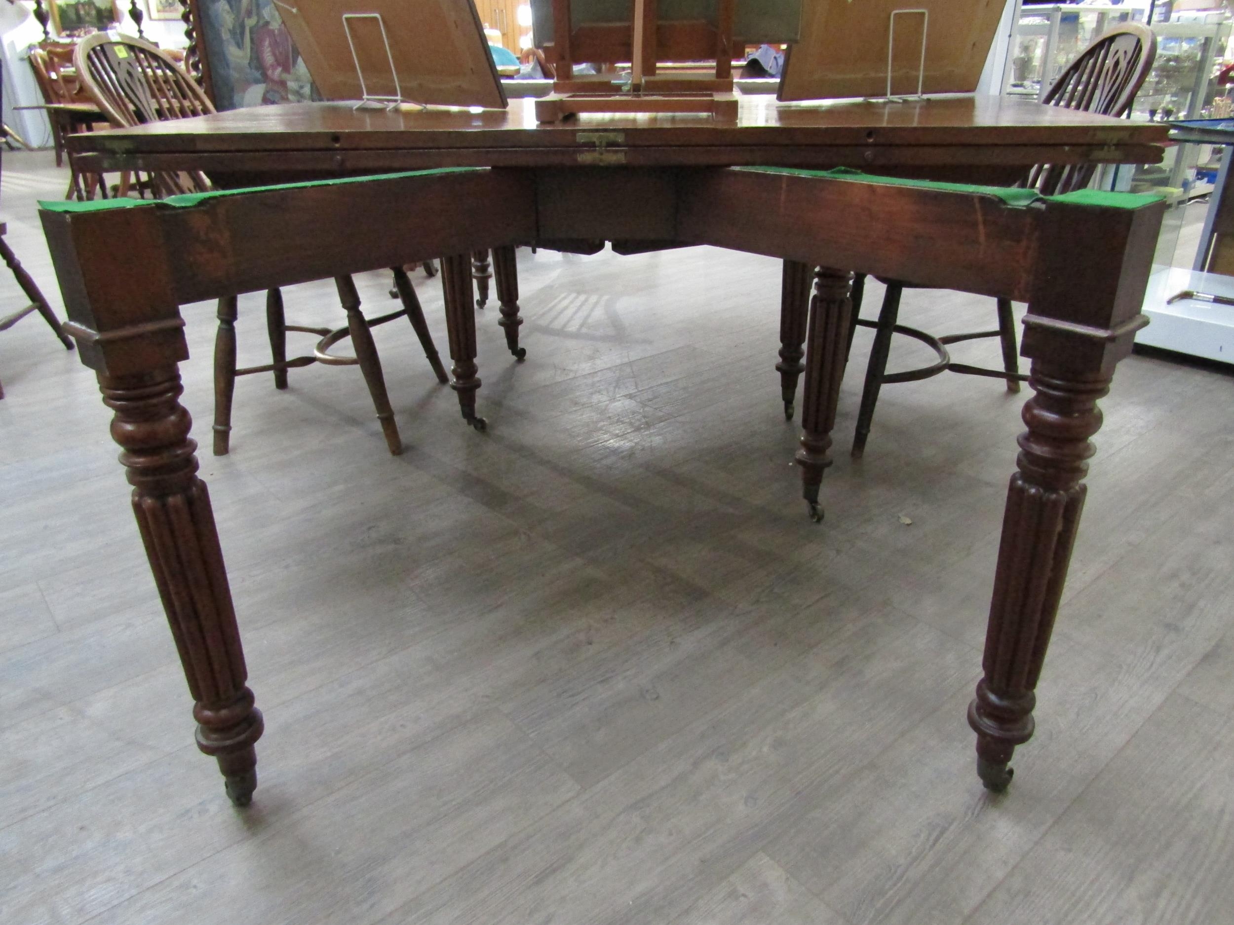 A Georgian mahogany concertina action extending dining table of rounded square form raised upon - Image 3 of 7