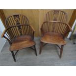 Two pairs of yew and elm Windsor stick-back solid seat armchairs with crinoline stretchers (4)