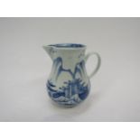 A Vauxhall cream jug c1755-1764 under glazed blue pagoda and willow trees on rocks fisherman in