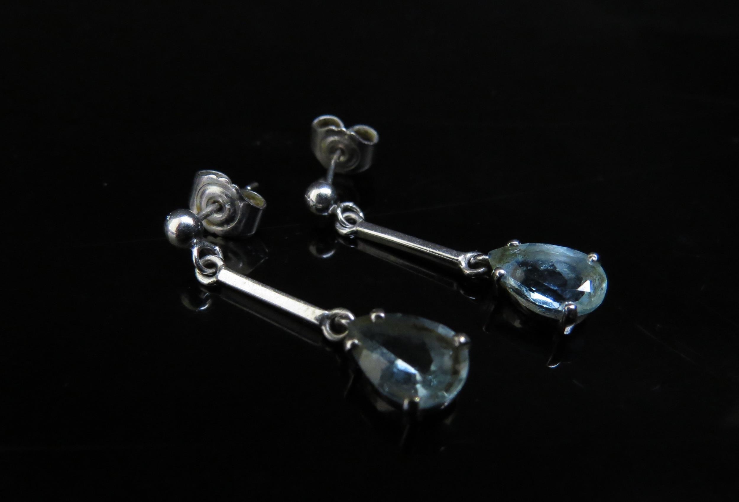 A pair of 18ct white gold pear shaped aquamarine drop earrings (2.13ct) 2.8cm drop, 2.7g, with