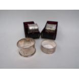 Two silver napkin rings, boxed, Birmingham 1907 and two others, 81g