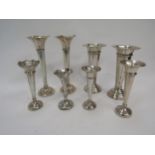 Eight various silver stem vases of varying sizes
