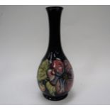 A Moorcroft Clematis pattern vase with slender neck, 26.5cm tall