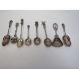 A selection of Continental white metal souvenir spoons including Windmill terminal and two from