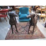 A pair of large bronze figures of greyhounds, 96cm tall approx 116cm long