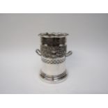 A silver plated repousse bottle holder with dionysus mask decoration, scrolling vines etc, 19.5cm