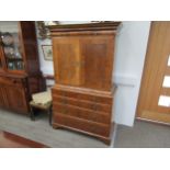 A William & Mary burr walnut veneered cabinet on chest, ogee pediment over single top drawer. The