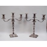 A pair of silver Roberts & Belk table centre piece three sconce candlesticks both converting to a