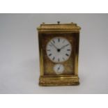 A French gilded carriage clock in gorge style case, fully engraved, with two keys